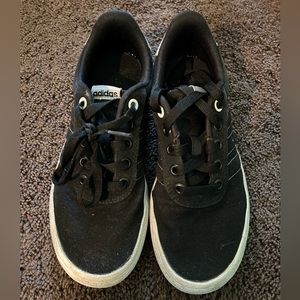 Black Addidas tennis shoes